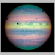 A rare alignment of some of Jupiter's moons and the shadows they are casting.jpg